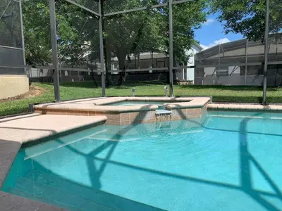 a large swimming pool in front of a building at Windsor Hill Resort Home w Pool, 5 Min from Disney in Orlando