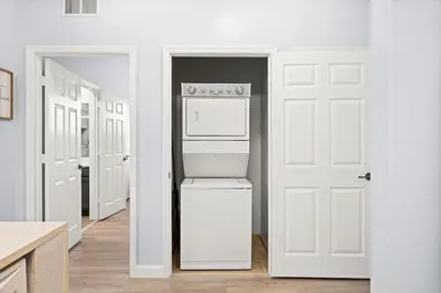 a kitchen with a refrigerator and a white door at Home sweet Home near Disneyland in Kissimmee