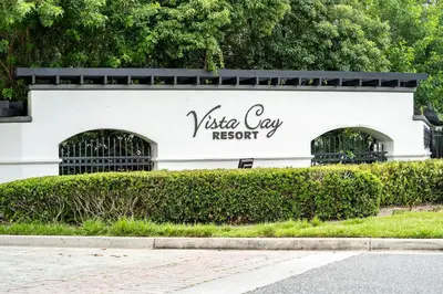 a white building with a sign that reads vista day resort at Vista Cay Resort in Orlando