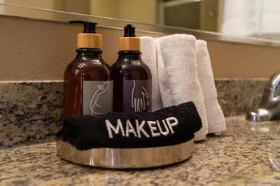 a couple of bottles on a counter in a bathroom at Pura Vida in Orlando
