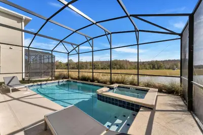 a swimming pool in a glass house with a roof at Storey Lake Resort, Private Pool, And Much More!! in Kissimmee