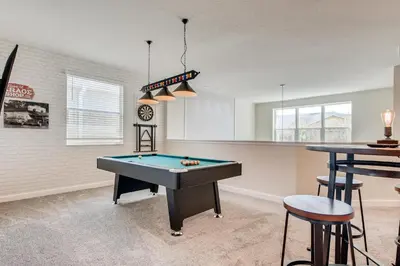 a living room with a pool table in it at 2751 BD -Luxury 5BR Single Family - Private Pool in Kissimmee
