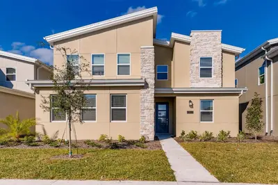 a large house with a driveway at 2859 BD - Grand Luxury Villa with a Sparkling Pool in Kissimmee