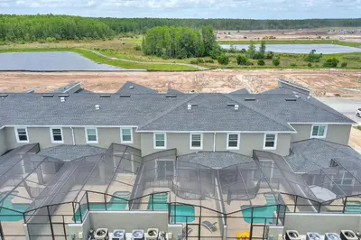 an aerial view of a house with a roof at Barefoot Breeze - Storey Lake By Shine Villas #833 in Kissimmee