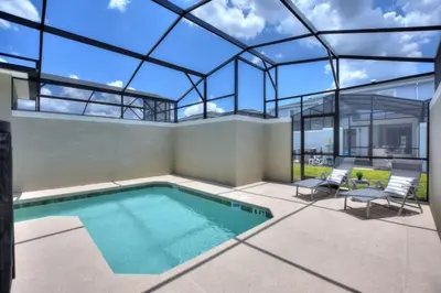 a swimming pool in a house with a glass ceiling at Magic Lily - Storey Lake By Shine Villas #834 in Kissimmee