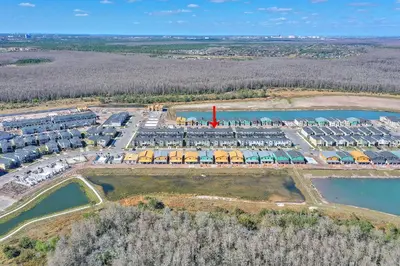 an aerial view of a resort complex next to a body of water at Blue Beach At Storey Lake By Shine Villas #400 in Kissimmee