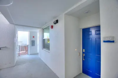 a hallway with a blue door in a room at Tranquility At Storey Lake By Shine Villas #828 in Kissimmee