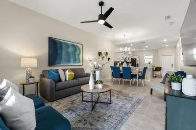 a living room with a couch and a table at Lake View At Storey Lake By Shine Villas #703 in Kissimmee