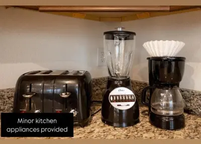 a blender and a toaster sitting on a counter at 350 Pendant · 350 Villa - 8BD - Private Pool - Game room in Orlando