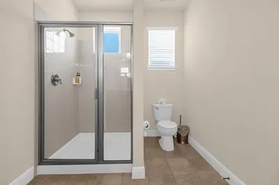 a bathroom with a shower and a toilet at 350 Pendant · 350 Villa - 8BD - Private Pool - Game room in Orlando