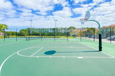 a basketball hoop on a tennis court at Mickeys Paradise - a fabulous 4 bed Paradise Palms Resort pool home that's close to Disney in Kissimmee