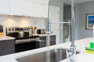 a kitchen with a sink and a faucet at Amazing Cozy Private Pool - 4404 in Kissimmee