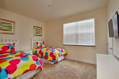 a bedroom with two beds and a window at 1523 Cozy Astonishing wPrivate Pool in Orlando