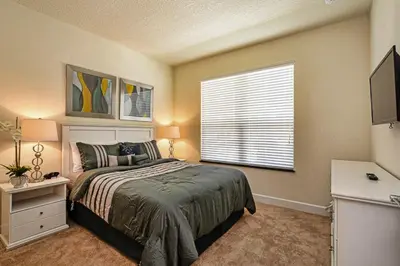 a bedroom with a large bed and a window at 1523 Cozy Astonishing wPrivate Pool in Orlando