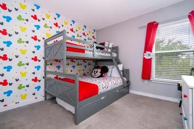 a bedroom with a bunk bed with a red crib at Modern 4 bedroom Home Private Pool 4451 in Kissimmee