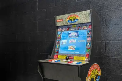 a video game machine is against a wall at 4712 Fabulous Brand-New Private Pool in Kissimmee