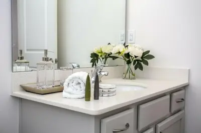 a bathroom counter with a sink and a mirror at 2606YA Luxurious En-Suite Single Home Pool in Kissimmee