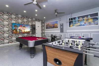 a gaming room with a pool table and a game table sidx sidx at Luxurious Home Private Pool 2693 in Kissimmee