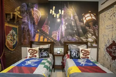 two beds in a room with a castle mural at 2620 Magical Memories 15 min-Disney in Orlando
