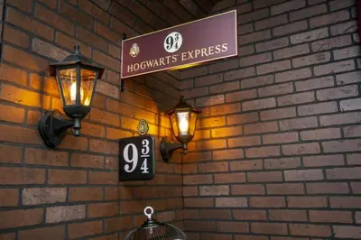 a brick wall with two lights and a sign on it at 2620 Magical Memories 15 min-Disney in Orlando
