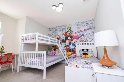 a white bedroom with a bunk bed and a ladder at 17419 Awesome Modern w Private Pool in Orlando