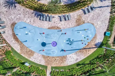 an overhead view of a swimming pool with people on it at Triple Header Storey Lake By Shine Villas #700 in Kissimmee