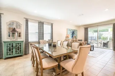 a dining room with a table and chairs at 350-360 Huge Villas - near Disney - 15 BDs in Orlando