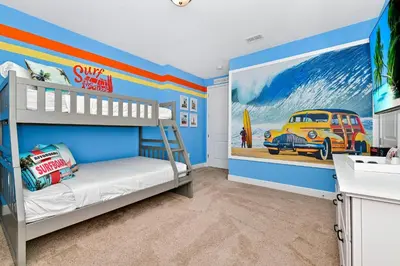 a bedroom with a bunk bed and a car mural at Charming Home Near Disney With Private Pool And Waterpark & Resort Access At Encore Resorts Reunion - 7389Mr in Kissimmee