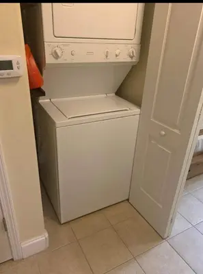 a white washer and dryer in a small kitchen at Disney 1 mile , Blue Heron 1 room 2 bath,amenities,6 guests, walk to restaurants, no fees at check in in Orlando