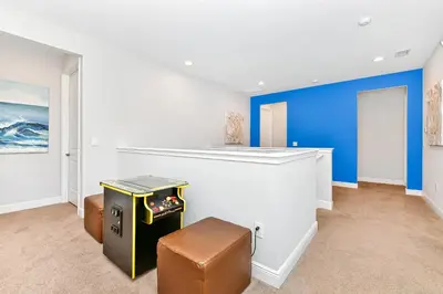 an empty room with a counter and a stool at Vibrant Home Near Disney With Media Room, Themed Rooms, Game Room And Waterpark & Resort Access At Encore Resorts Reunion - 7450Mr in Kissimmee
