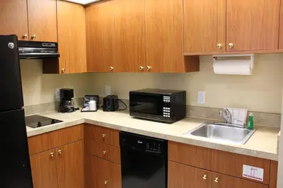 a kitchen with a sink and a microwave at Great Condo Incredible Location in Orlando