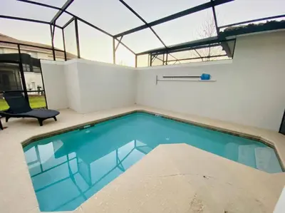 a swimming pool in a house with a glass ceiling at Excellent Resort Free/ Makin Memories / 4 Beds in Kissimmee