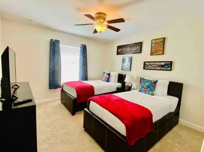 a bedroom with two beds and a ceiling fan at Excellent Resort Free/ Makin Memories / 4 Beds in Kissimmee