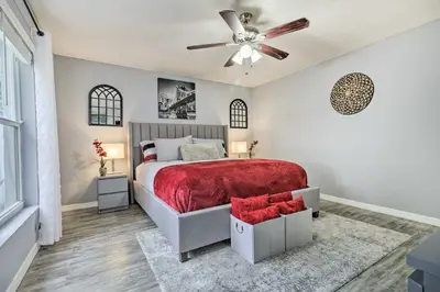 a bedroom with a bed and a ceiling fan at Chic Orlando Family Getaway with Fenced Yard! in Orlando