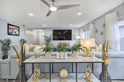 a living room with a couch and a table at Chic Orlando Family Getaway with Fenced Yard! in Orlando