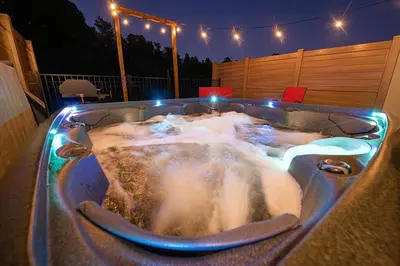 a bath tub filled with water with lights in it at 3BR Resort Pool Jacuzzi Minutes to Disney 4730 in Kissimmee