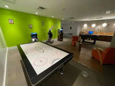 a room with a ping pong table in the middle of a room at Newly Room in cozy hotel with Super location to the Parks in Kissimmee