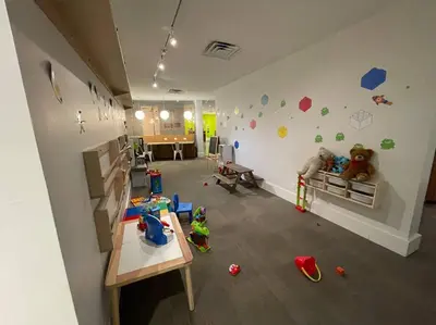 a room with a room with toys on the wall at Newly Room in cozy hotel with Super location to the Parks in Kissimmee