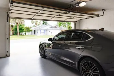 a car garage with a car parked in it at Orlando Boho Villa in Kissimmee