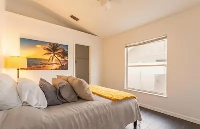 a bedroom with a bed and a window at East Orlando Getaway - 3BR/2BTH - *Pool *Parking in Orlando