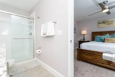 a bedroom with a shower and a bed and a bathroom at Mickey Safari near Disney 2 Master rooms 4708 in Kissimmee