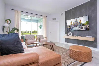 a living room with a couch and a table at Modern Resort FREE Waterpark Near Disney 3171 in Kissimmee