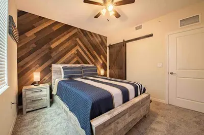 a bedroom with a bed and a ceiling fan at Resort Condo Near Disney FREE Waterpark 3120 in Kissimmee