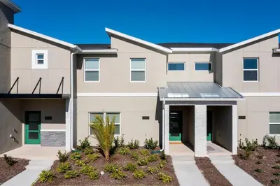 a large apartment building with a driveway at Modern Clean home Private Pool close Disney 2968 in Kissimmee