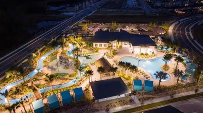 an overhead view of a pool at a resort at night at FREE Waterpark 4BR Marvel Superhero-Themed 2967 in Kissimmee