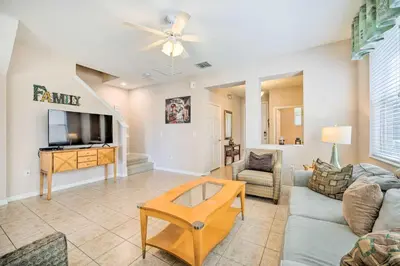 a living room with a couch and a tv at Kissimmee Getaway about 4 Mi to Walt Disney World in Kissimmee