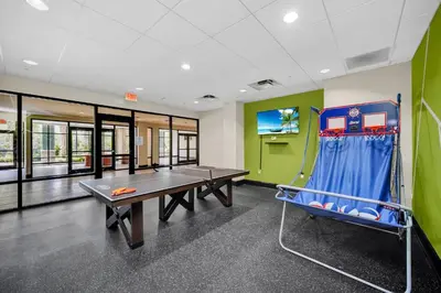 a ping pong room with a ping pong table at Spacious 3BR Condo with Pool near Disney in Orlando
