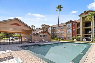a swimming pool at a apartment complex with condos at very Nice 2/2 apartment , close to disney in Kissimmee