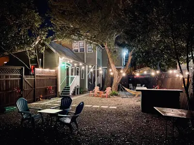 a backyard at night with chairs and a playground at Boho Nights in Sanford