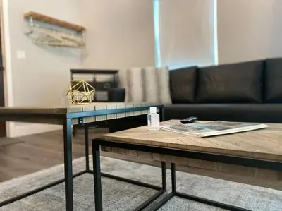 a living room with a couch and a coffee table at The Jazz Loft in Sanford